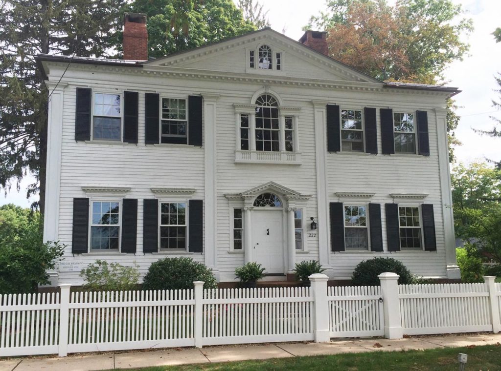 Fancy historic Federal home with two Palladian windows and a dentil molded dormer.