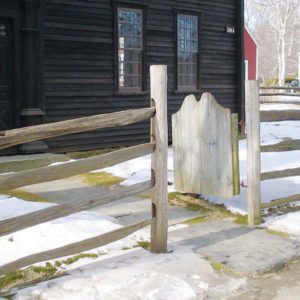 Split rail fence with a solid board gate 