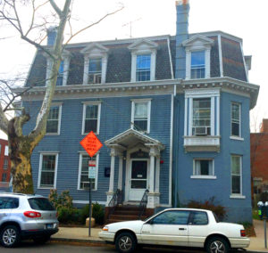 Perhaps this house started as something more modest but the French Second Empire Mansard Roof and two story addition confuse the style label.